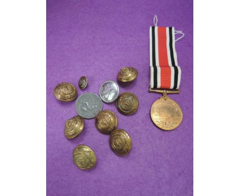 A selection of vintage police related buttons and medallion