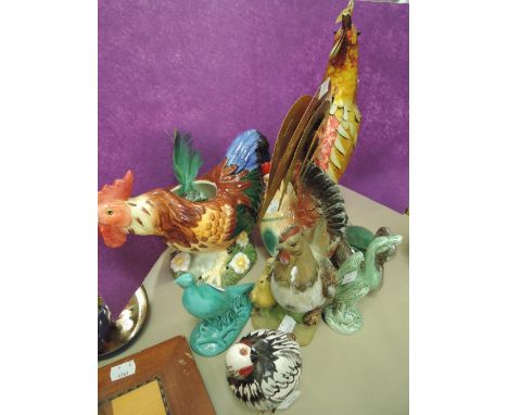 A selection of vintage bird figures and decorations including hens and cockeral