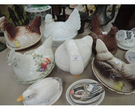 A selection of vintage ceramic egg nest and bird containers