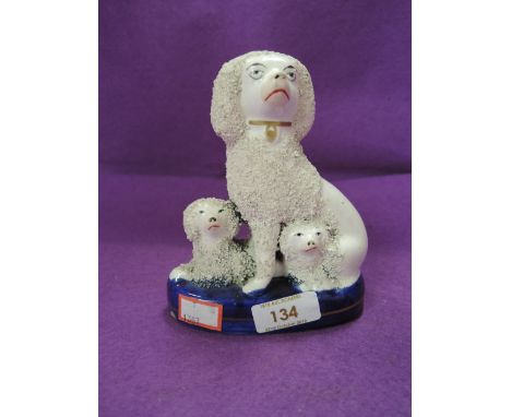 A vintage Staffordshire flat back of a dog