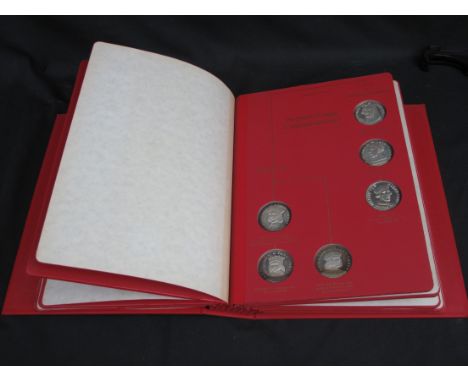 'THE KINGS AND QUEENS OF ENGLAND', AN ALBUM OF SILVER MEDALLIONS produced by John Pinches (Medallists) Ltd., complete from th