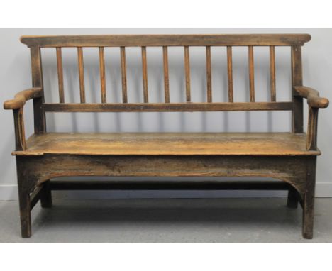 19TH CENTURY PINE STICK BACKED SETTLE, with over hanging top rail, open scroll arms and square legs. 61" x 17" x 39.5". 155cm