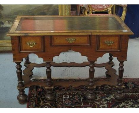 18TH CENTURY DESIGN WALNUT WRITING TABLE having moulded cross banded edge top with inset tool leather writing surface above t