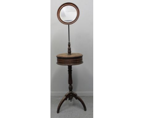 19TH CENTURY MAHOGANY SHAVING STAND WITH CIRCULAR BEVELLED MIRROR, above moulded two section platform on a ring turned gun ba