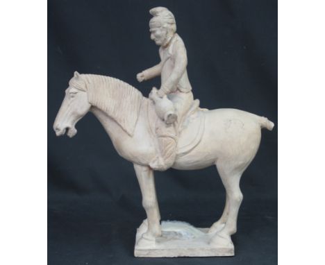 CHINESE TANG STYLE TERRACOTTA TOMB FIGURE OF A MOUNTED MAN holding flask, on square base.  27.5cm high. CONDITION REPORT: Som