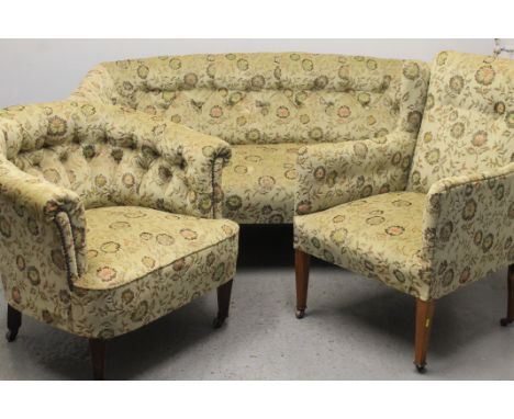 EDWARDIAN BUTTON UPHOLSTERED THREE PIECE PARLOUR SUITE with two tub chairs, two seater sofa, together with a similarly uphols