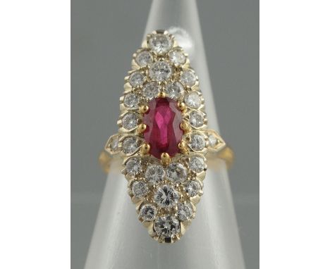 AN EARLY 20TH CENTURY 18CT GOLD, RUBY AND DIAMOND MARQUISE SHAPED CLUSTER RING.  The oval ruby surrounded by diamonds with di