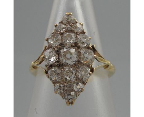 EARLY 20TH CENTURY DIAMOND MARQUISE SHAPED CLUSTER RING set with seventeen old cut diamonds.  22 x 12mm.  Ring size N.  Weigh