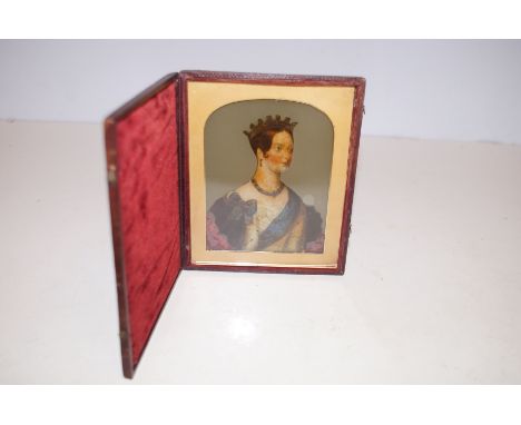 An unusual mid-19th century reverse printedand painted glass miniature portrait of YoungQueen Victoria, contained in a period