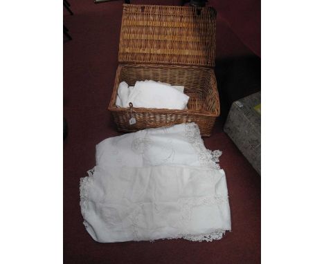 Four Large Damask and Embroidered Sheets, etc in a wicker hamper box.