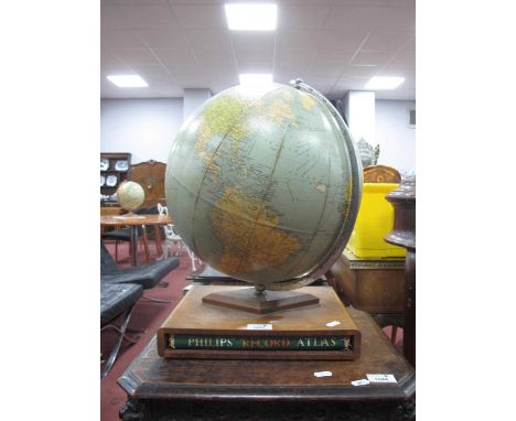 Phillips Challenge Globe, with chrome meridian ring, on teak base holding Phillips record atlas.