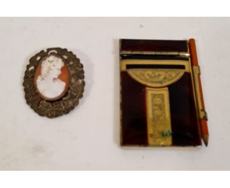 A hallmarked vintage gilded silver cameo brooch and an early 20th century ladies notelet or dance record. 