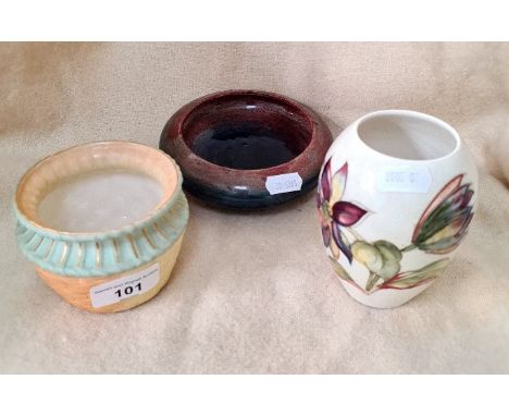 A Moorcroft bowl, a Moorcroft small vase and a Royal Worcester bowl. 