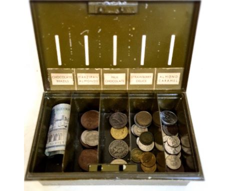 A vintage savings tin with old British / World coins and notes. 