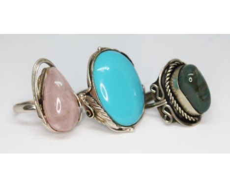 Three Art Nouveau style cahochon rings comprising one set with rose quartz and another reconstituted turquoise both marked '9