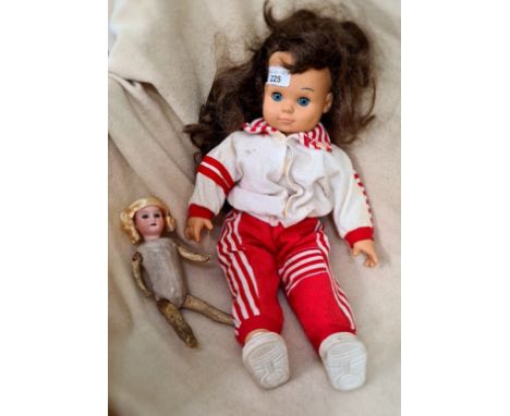 A vintage Simba doll, fully clothed and a cca 1910 - 1920 antique German small doll with bisque head, having inscribed on the