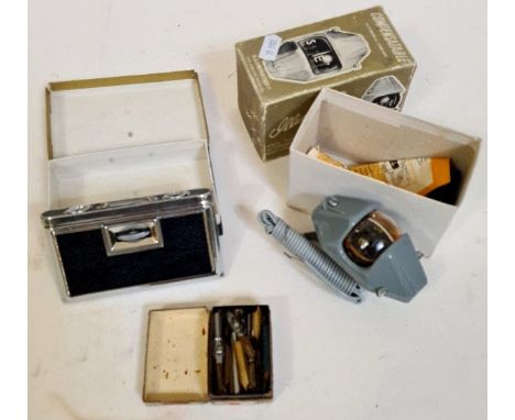 A boxed Compensatable automobile compass, Alpha opera glasses and a collection of pen nibbles. 
