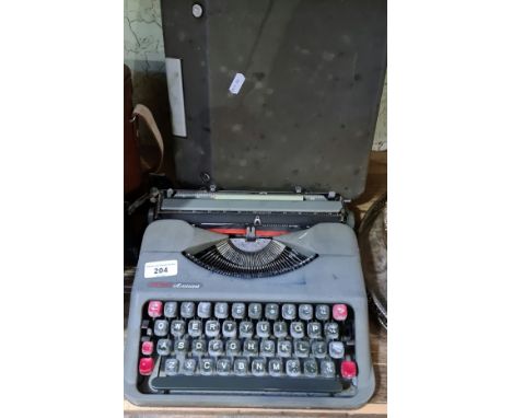 A 1960s vintage Empire Aristocrat typewriter in original case. 