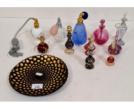 Perfume bottles together with a decorative art glass plate 