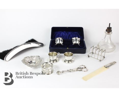 Sterling silver miniature tea cups and saucers,a miniature silver toast rack, Birmingham hallmark, mm H & H, dated 1938, silv