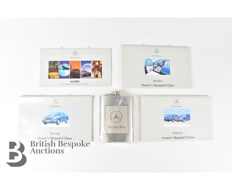 Mercedes-Benz memorabilia, an unused 1970's Mercedes-Benz stainless steel spirit hip flask, together iwth 4 x MBE-class owner