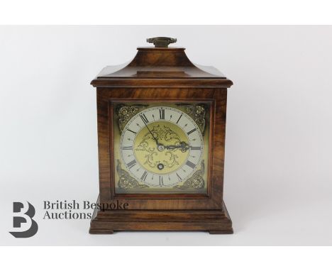 A mahogany cased mantel clock, brass and brushed steel face with Roman dial, movement by Astral of Coventry complete with key