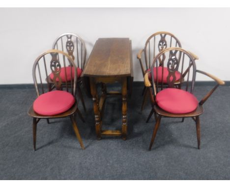 Four Ercol dining chairs and an oak gate leg table 