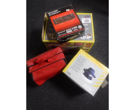 A boxed steam cleaner, car cleaning kit, car polisher, an in car stereo cassette deck and a therapy lamp 