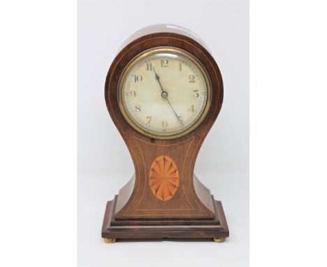 A late Victorian balloon shaped inlaid mahogany mantel clock