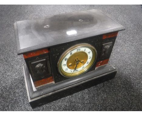 A Victorian black slate mantel clock with brass and enamelled dial 