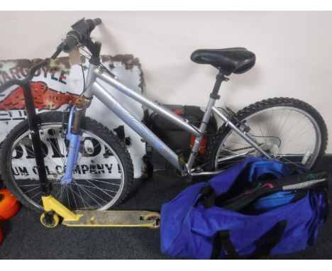 A girl's Apollo mountain bike, scooter, car booster seat and a bag of sports equipment 