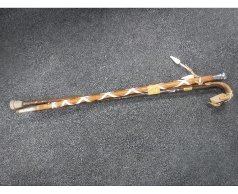 A military stick with silver pommel and two antique walking sticks 