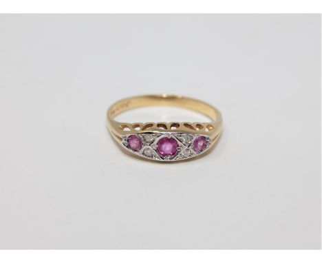 An 18ct gold ruby and diamond ring, size O