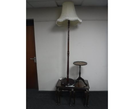 A nest of two mahogany coffee tables, standard lamp and shade and a wine table 