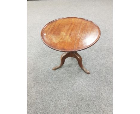 A George III mahogany tripod low table, width 61cm