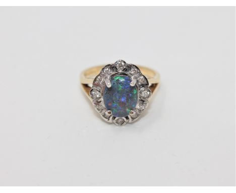 An 18ct gold triplet opal and diamond cluster ring, size O1/2