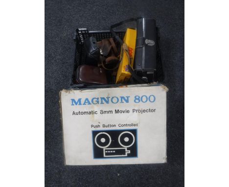 A boxed Magnon 800 projector, a basket of cameras and camera flash 