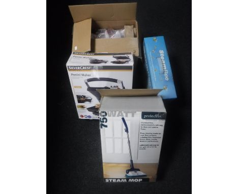 A back massager, floor lamp, panini maker and three assorted steamers 