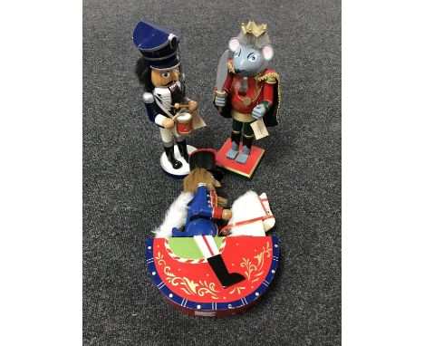 Three wooden nutcracker figures