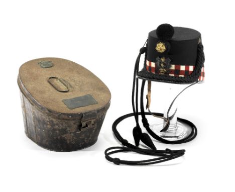 A CASED SHAKO FOR AN OFFICER OF THE HIGHLAND LIGHT INFANTRY BY SANDILANDS & SON, LONDON, 20TH CENTURY with cap badge, cockade