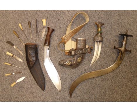 A NEPALESE KUKRI KNIFE, AN ARAB JAMBIYA AND AN INDIAN SWORD, 19TH/20TH CENTURY the first with curved blade, hardwood grip, in