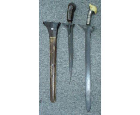 ##AN IVORY-HILTED SHORTSWORD (KERIS) AND MORO SHORTSWORD (KERIS), LATE 19TH/20TH CENTURY the first with broad double-edged bl