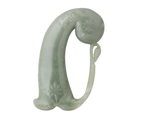 AN INDIAN JADE HILT FOR A DAGGER, 19TH CENTURY of carved green jade, comprising pistol-shaped grip decorated with a lotus flo