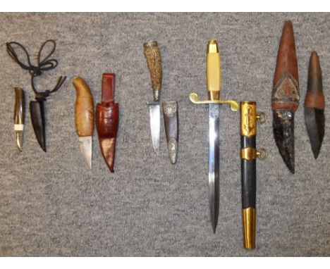 A SMALL HUNTING KNIFE; TWO SMALL SCANDINAVIAN HUNTING KNIVES AND TWO ESKIMO KNIVES, 19TH CENTURY the first with tapering blad