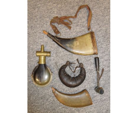 THREE POWDER-FLASKS AND A POWDER MEASURE, 18TH/19TH CENTURIES the first of flattened cowhorn, engraved with a stag hunting sc