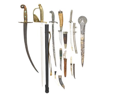 A GROUP OF MINIATURE EDGED WEAPONS, 19TH/20TH CENTURY including a Central European officer's sword, with curved blade, gilt-b