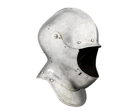 A GERMAN CLOSE HELMET FOR HEAVY FIELD USE, LACKING ITS VISOR, CIRCA 1530 with rounded one-piece skull rising to a low medial 