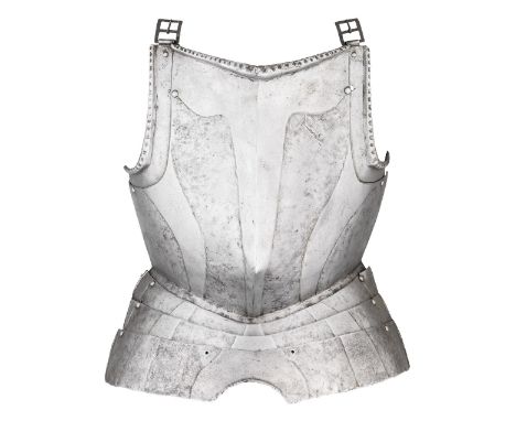 A GERMAN BREASTPLATE WITH EMBOSSED DECORATION IN THE 'BLACK AND WHITE' FASHION, CIRCA 1580 with a medially ridged main plate 