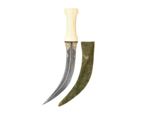 ##AN INDO-PERSIAN DAGGER (JAMBIYA), 19TH CENTURY with curved double-edged blade of watered steel, formed with a full-length c