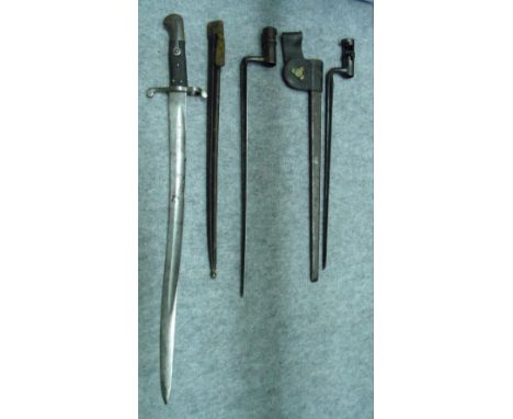 A MODEL 1835/42 SOCKET BAYONET, ANOTHER, PROBABLY MODEL 1873 AND A BRITISH 1856 PATTERN ENFIELD BAYONET the first in its scab